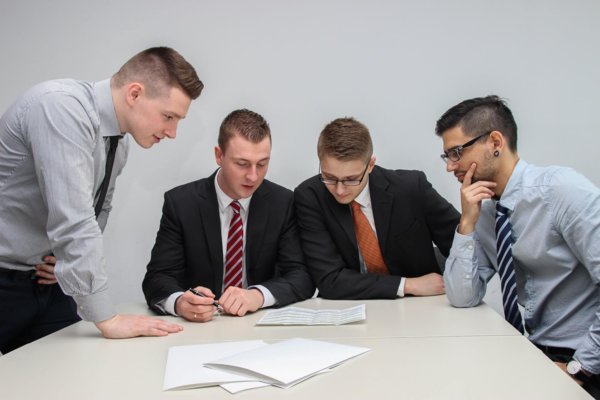 men around a table